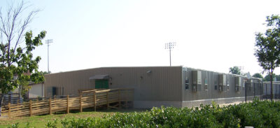 A large 126’ x 64’ semi-permanent modular building totaling 8,064 square feet used for extra classrooms